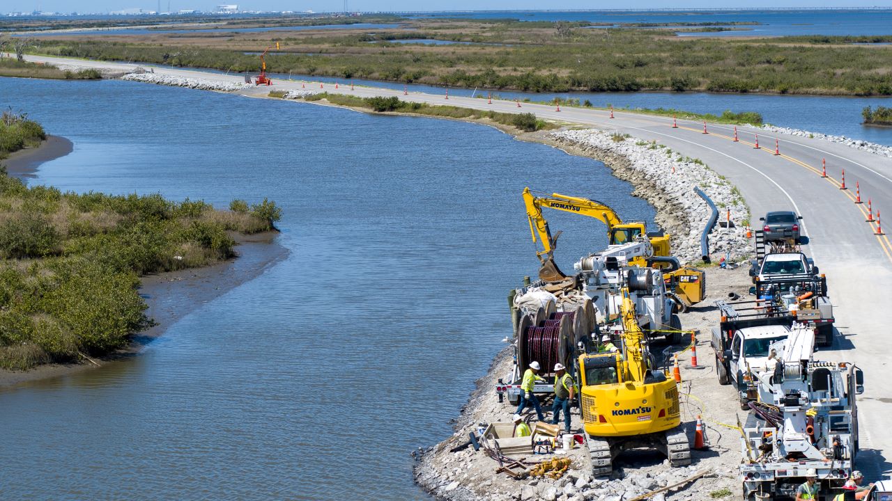 Pictured are workers undergrounding a portion of the distribution system in Grand Isle. 